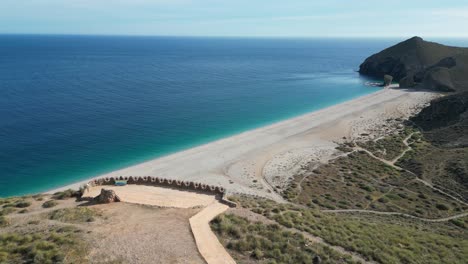 Playa-de-los-Muertos-Beach-and-viewpoint-in-Cabo-de-Gata,-Andalusia,-Spain---Aerial-4k