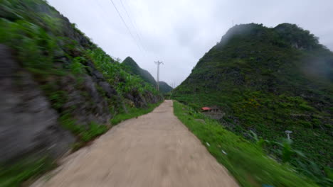 pov of scooter riding on dangerous narrow road at ha giang loop, fell down the roadside in vietnam. tracking shot