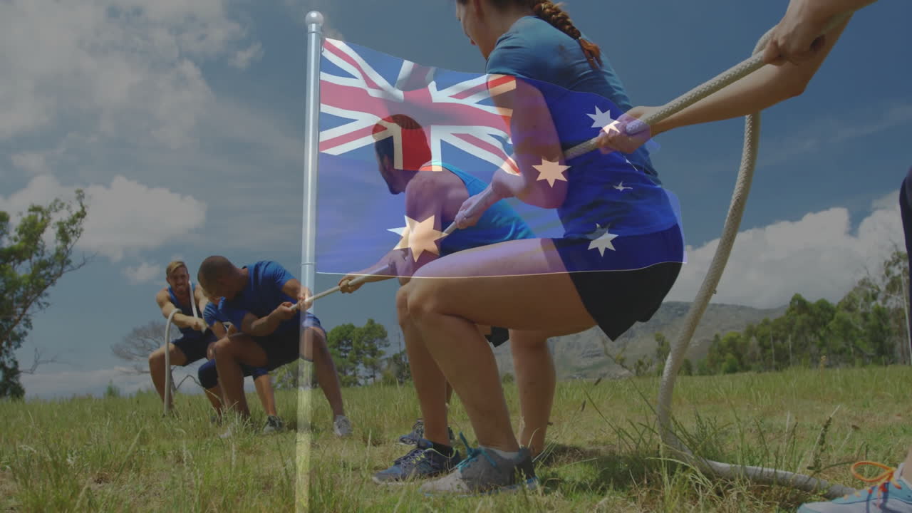 People playing tug-of-war over Australian flag animation on grassy field