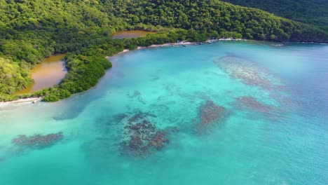 majestic tour over caribbean beach with turquoise waters in tayrona national park, colombia