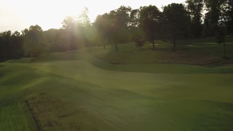 sun shining brightly over a golf course