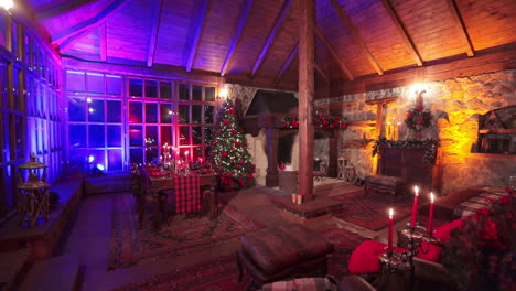 large and cozy room in a country mansion prepared for celebrating christmas. beautiful festive interior in a village house of stone and wood.