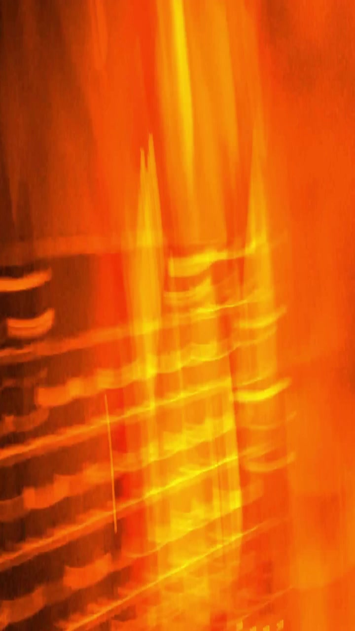 Abstrakter Bewegthintergrund mit leuchtenden gelben und orangen Lichtstreifen