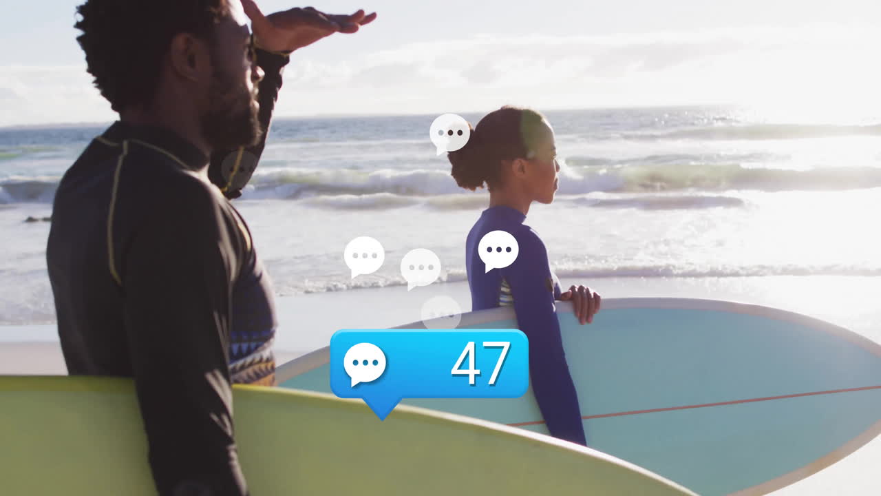 Two friends standing on beach holding surfboards, showing animated wave graph for travel