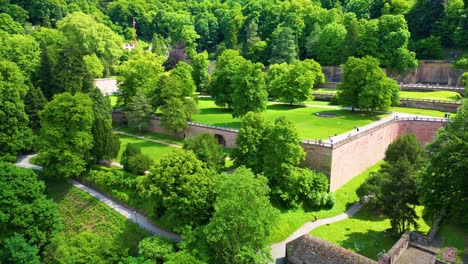 4k aerial drone video of gardens surrounding the historic castle on königstuhl hill overlooking heidelberg, germany