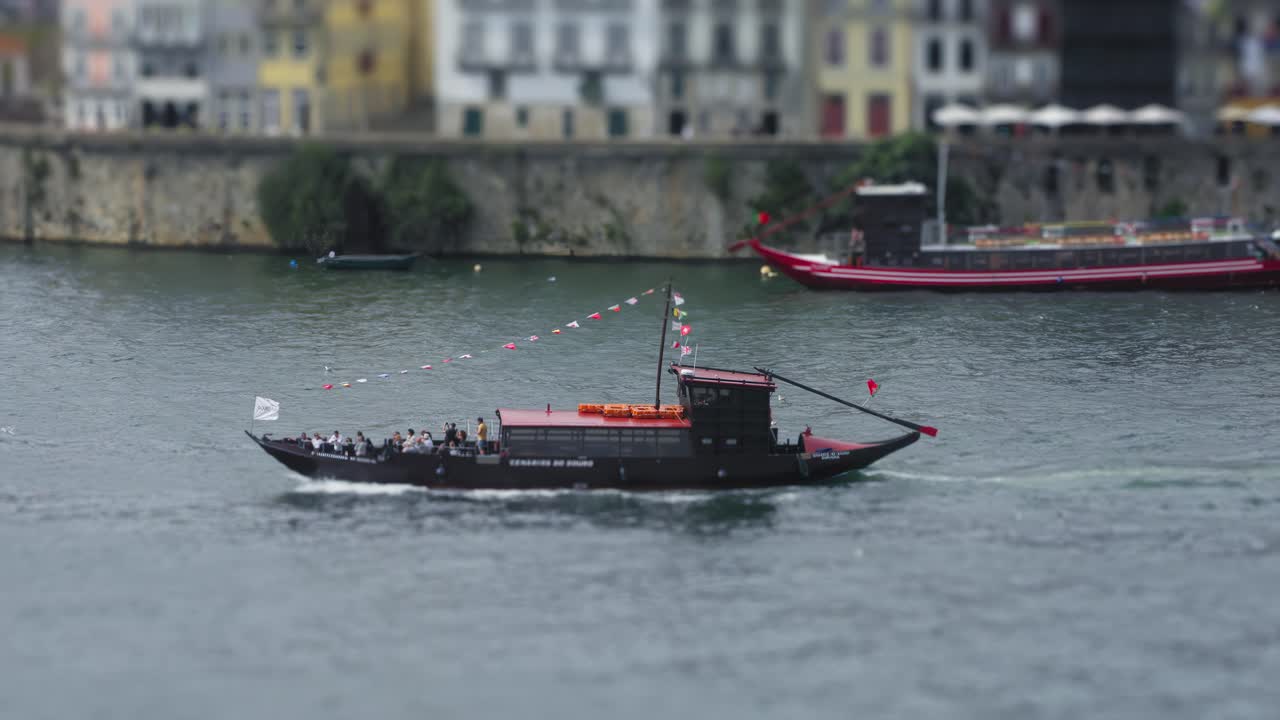Ferry moving through the Douro River in Porto, Portugal