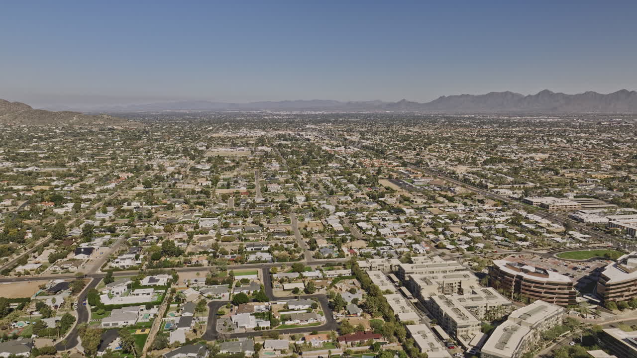 Scottsdale Arizona Aerial v15 drone flyover and around downtown area capturing cityscape of the neighborhoods and panoramic views of desert mountainscape - Shot with Mavic 3 Cine - February 2022