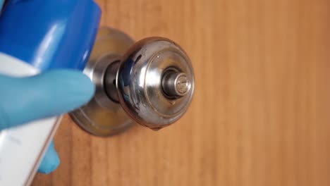 disinfecting a door handle