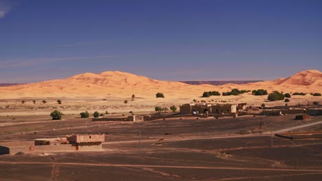 panning shot of great sand dunes in moroccan desert merzouga