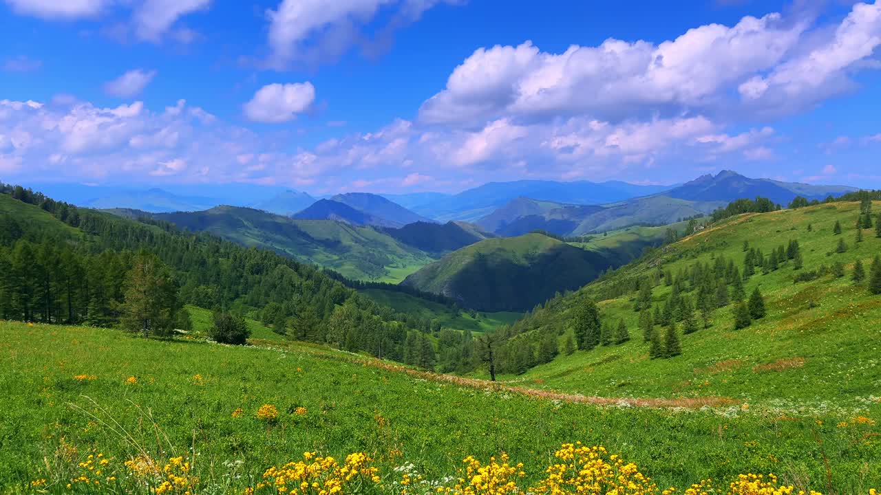Stunning Panoramic View of Lush Green Hills and Scenic Blue Sky with Fluffy Clouds in a Serene Mountain Landscape