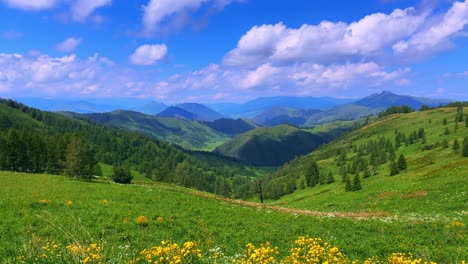 stunning panoramic view of lush green hills and scenic blue sky with fluffy clouds in a serene mountain landscape