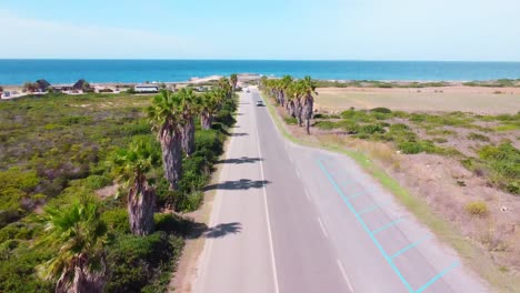Road-to-the-beach-drone-shot-tilt-in-Sardinia