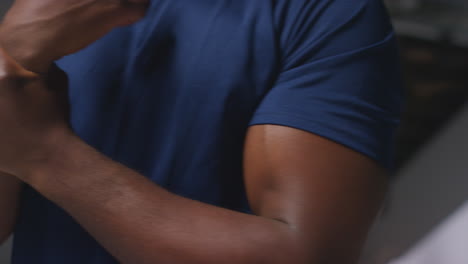 close up of male athlete training in gym stretching warming up and preparing psychologically for sports event