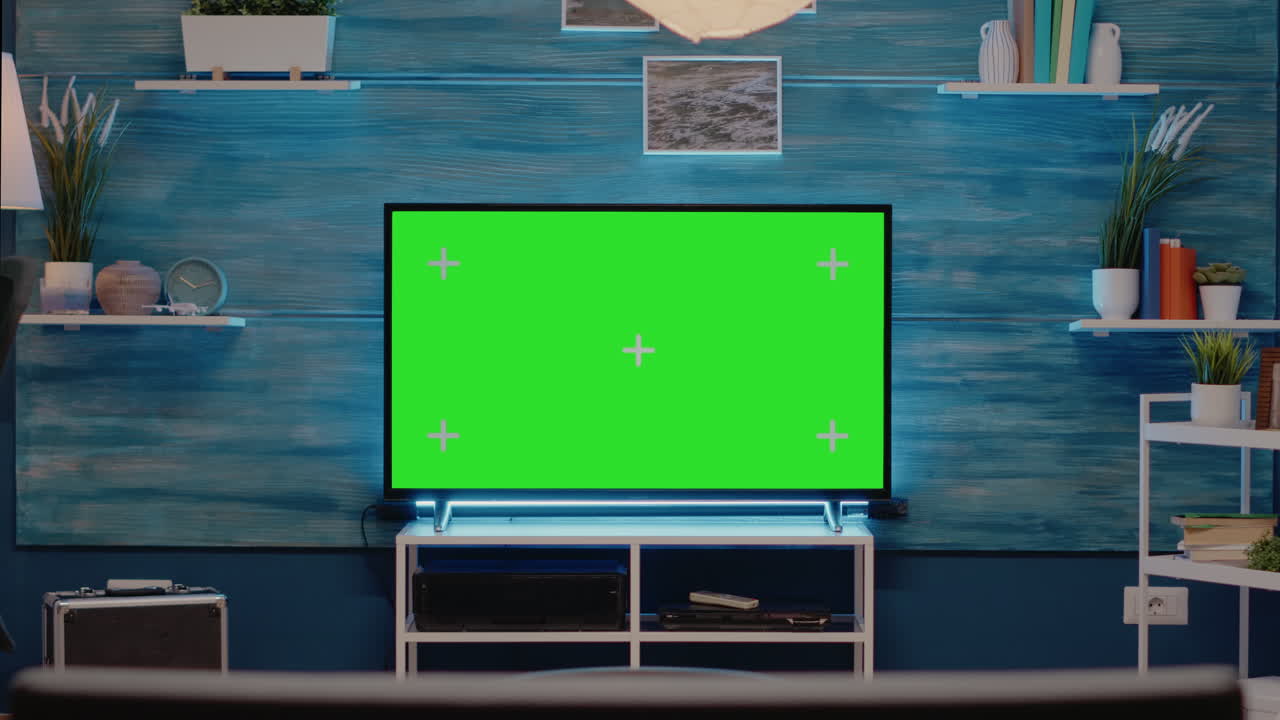 Empty room with green screen on television monitor