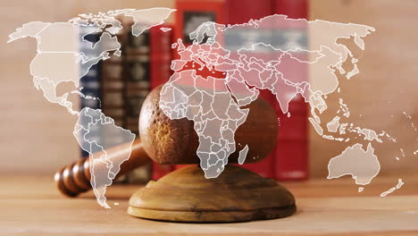 animation of world map over wooden gavel