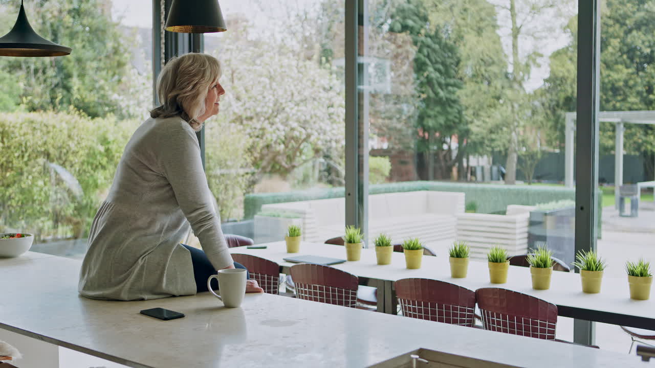 People enjoying view of the garden from inside the house