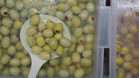 preserved green olives in containers