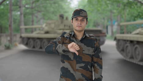 disappointed indian army man showing thumbs down