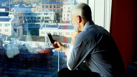 Businessman-using-mobile-phone-in-hotel-room-4k