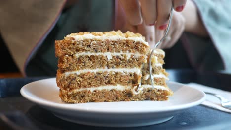 a slice of carrot cake with cream cheese frosting