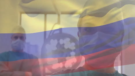 Animación-De-La-Bandera-De-Colombia-Ondeando-Sobre-Cirujanos-En-Quirófano