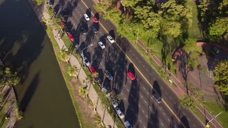 aerial tracking shot of traffic on sarmiento avenue in buenos aires city at golden hour