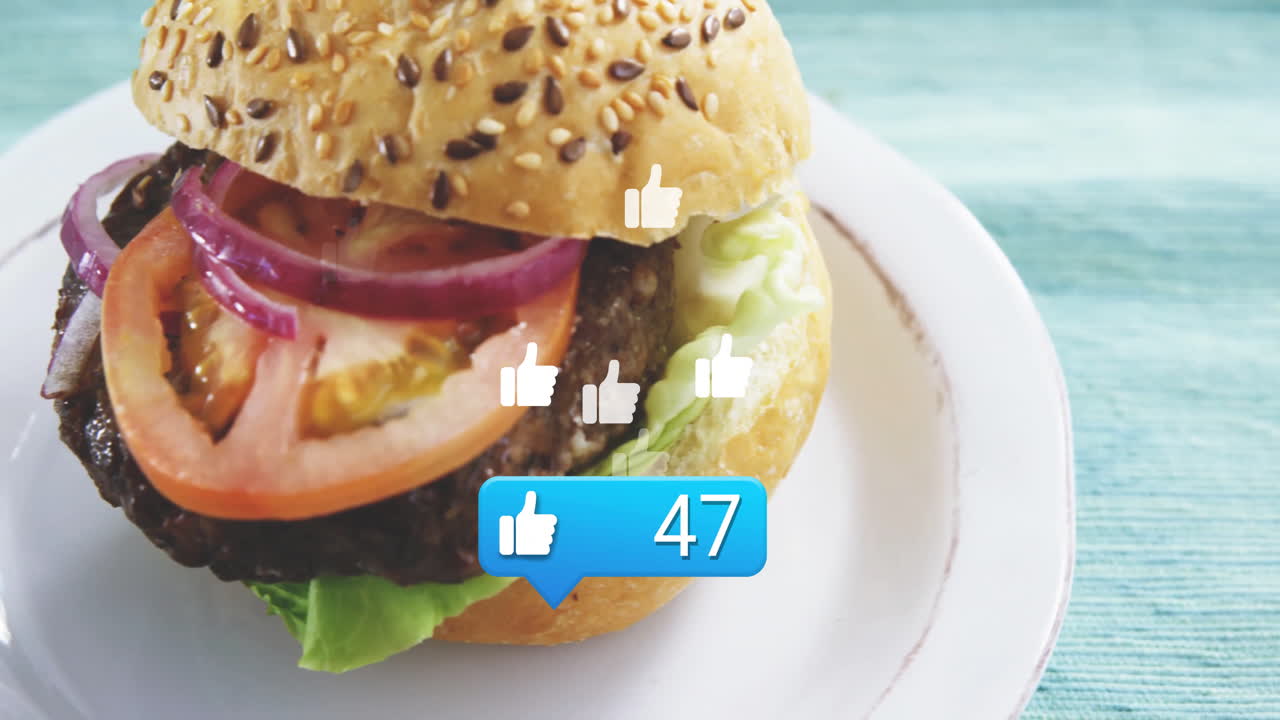 Receiving social media likes, burger with sesame seed bun on white plate