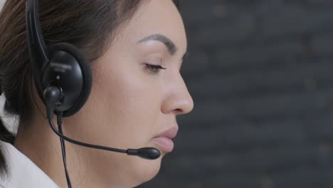 woman call centre operator, customer support agent wears headset consults client online, typing on laptop, talk in internet computer chat, helpline operator secretary make conference video call