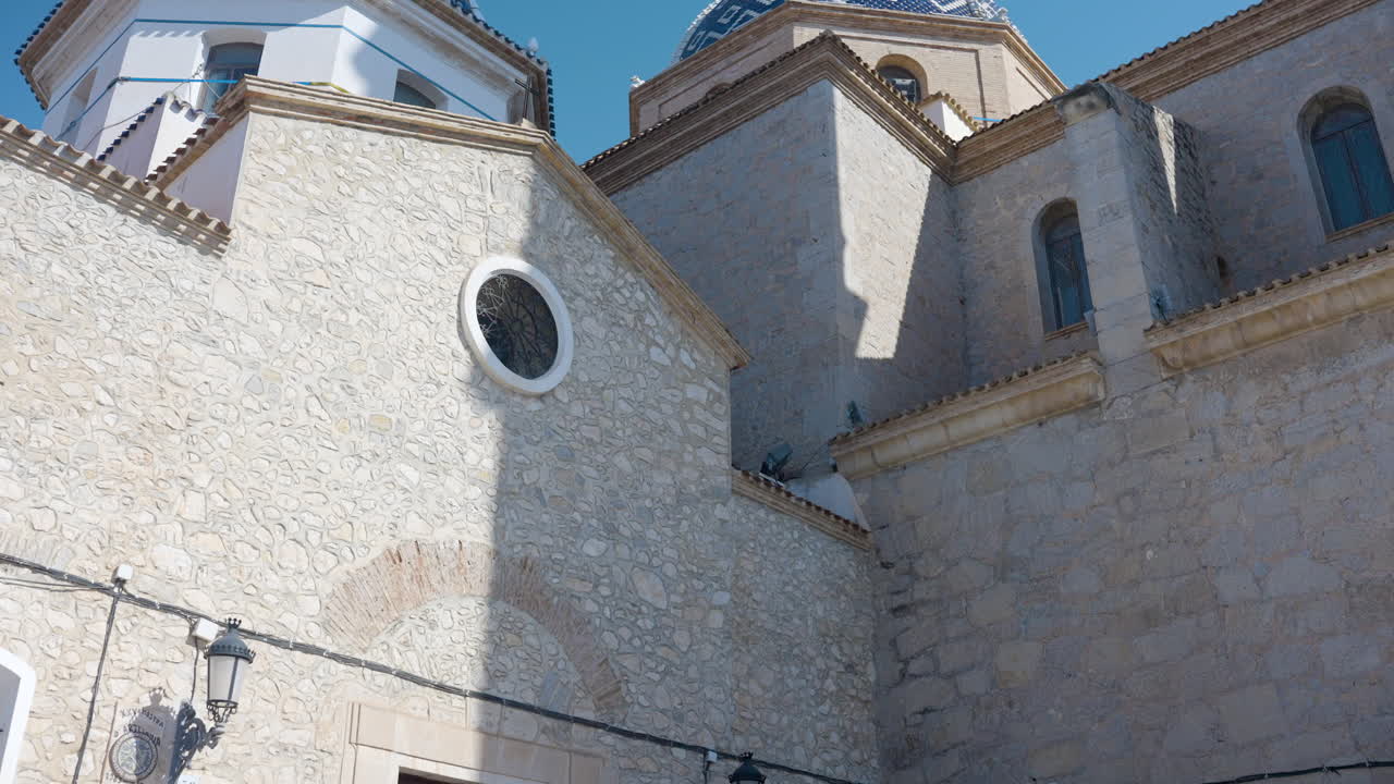 Exterior of a Spanish Church with Blue and White Domes