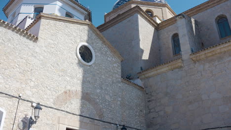 exterior of a spanish church with blue and white domes