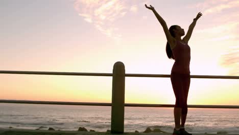 Sporty-woman-with-arms-raised