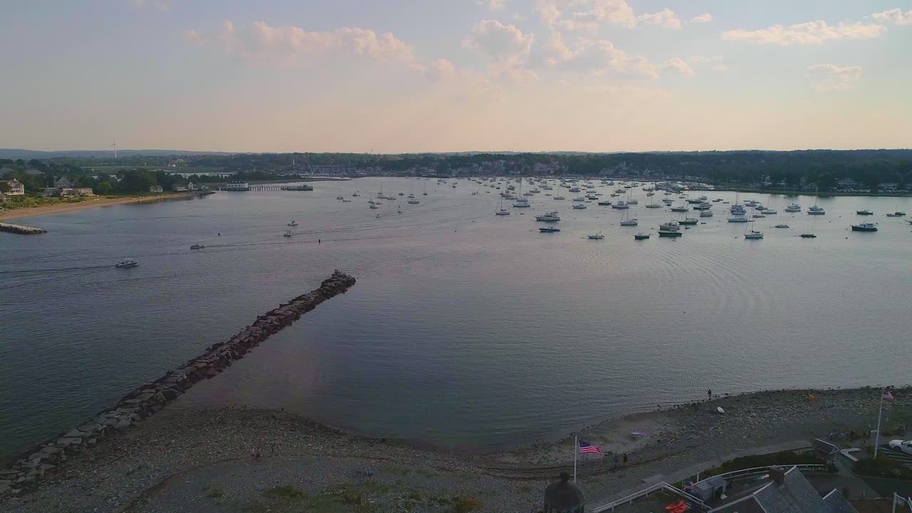 Massachusetts Lighthouse with an American flag, Harbor with lots of boats