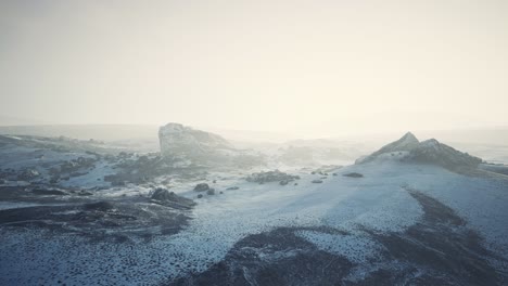 antarctic mountains with snow in fog