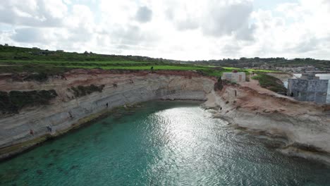 Munxar-Window-Top-View,-Limestone-Cliff-Side,-Turquoise-Water,-Malta-Island