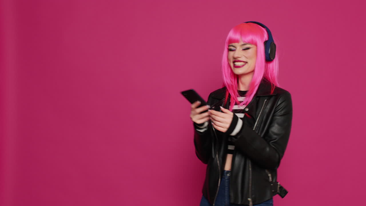 Cool trendy person listening to music and using social media