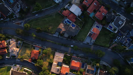 aerial view above wealthy houses, sunset in sao paulo, brazil - top down, drone shot