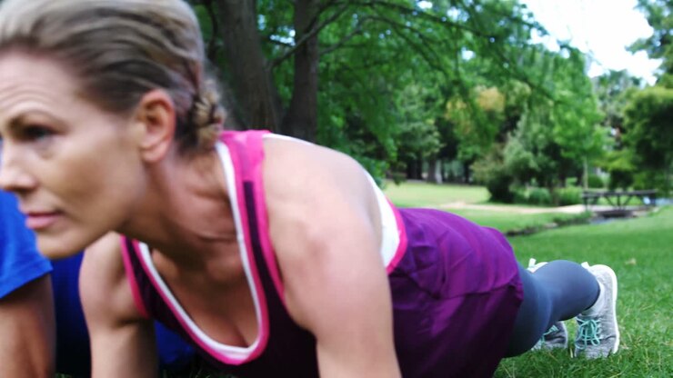Group of people exercising together in the park