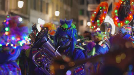 colorful illuminated carnival band playing music sound on the street in the evening,static