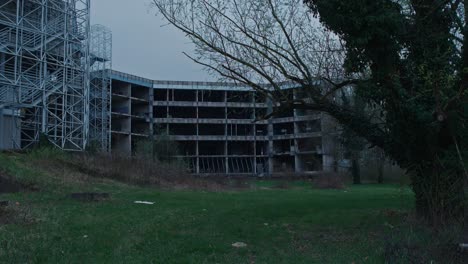 Abandoned-circular-hospital-building-in-Zagreb's-overgrowth,-Croatia