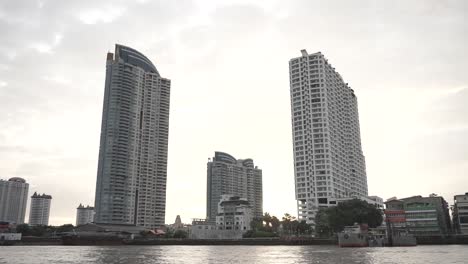 passing trough the river, over the building, by boat