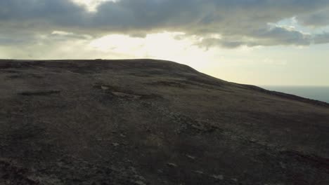 Aerial-Drone-Rising-Shot-With-Dramatic-Clouds-and-Sky-Over-Moorland-in-North-Devon-UK