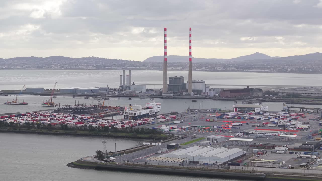 Busy shipping port with ferries and cargo in Dublin, Ireland on a cloudy day