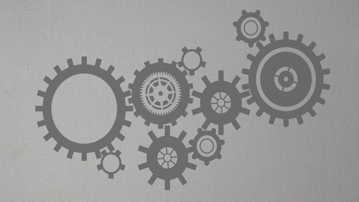 Animation of moving mechanical gears against gray background