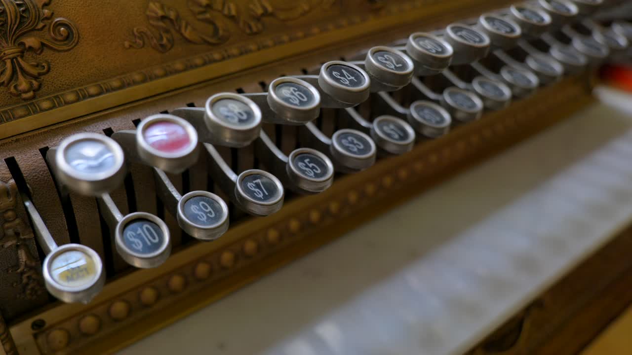 The keys or latches of an antique cash register
