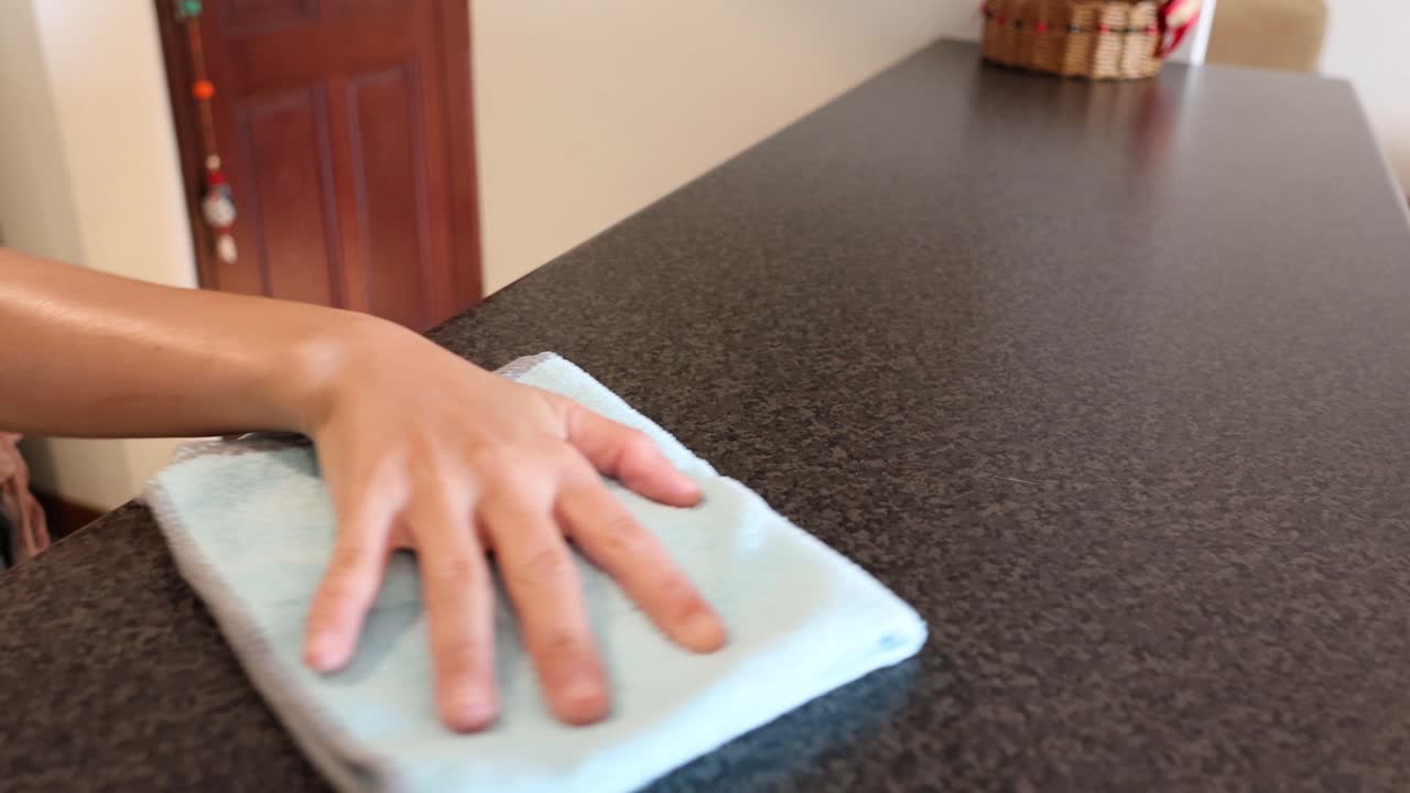 Sequential demonstration of folding a towel neatly