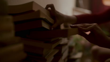 woman arranging books