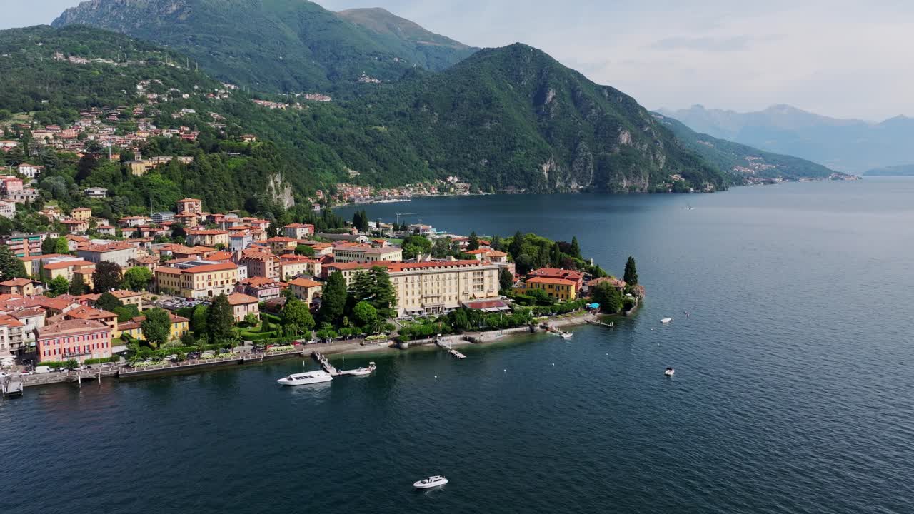Aerial view of Menaggio with lake reflections, warm light and scenic buildings