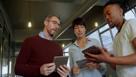 business people discussing over digital tablet in office 4k