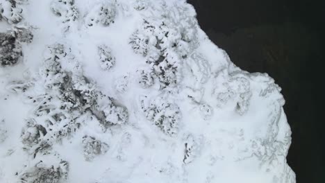 Frozen-trees-and-ice-formations-on-a-snowy-forest,-winter-landscape