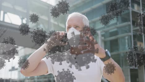 animation of covid 19 cells over senior man wearing face mask